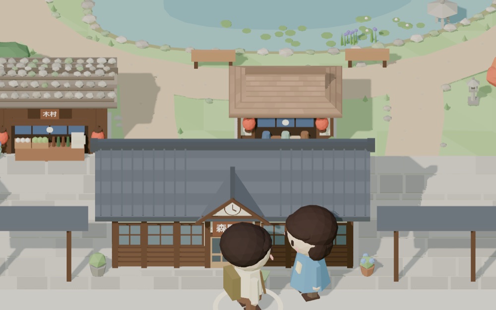 Morino from above: thatched roofs around a pond, the little station and its train.
