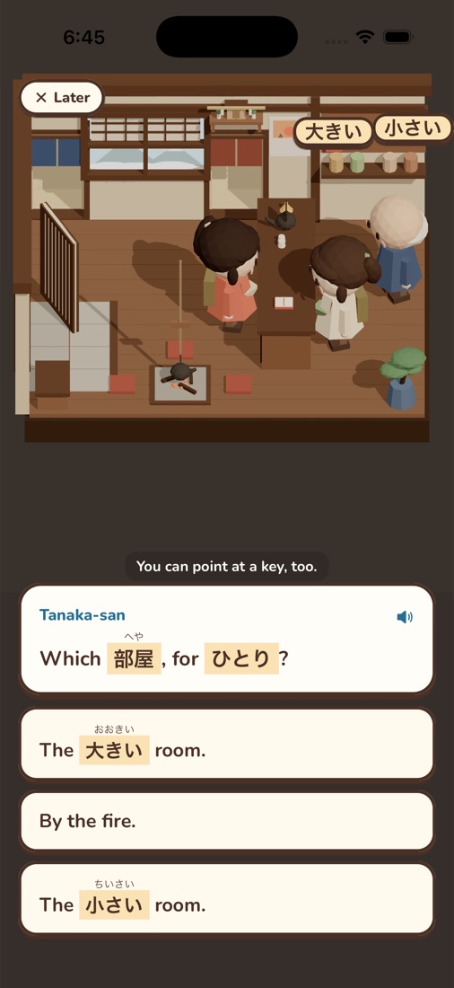 Checking in a guest at the counter. Tanaka-san asks which room, for one person; the Japanese words have their readings above them.